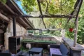 l'Écurie, buiten-terras met zicht op tuin