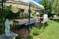 prieel terras met BBQ en pizza-oven